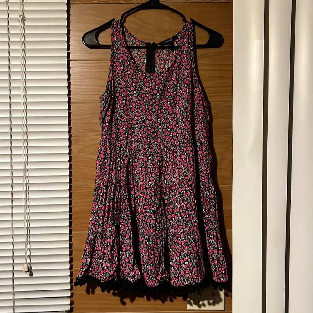 Floral dress with fuzz balls on the dress skirt